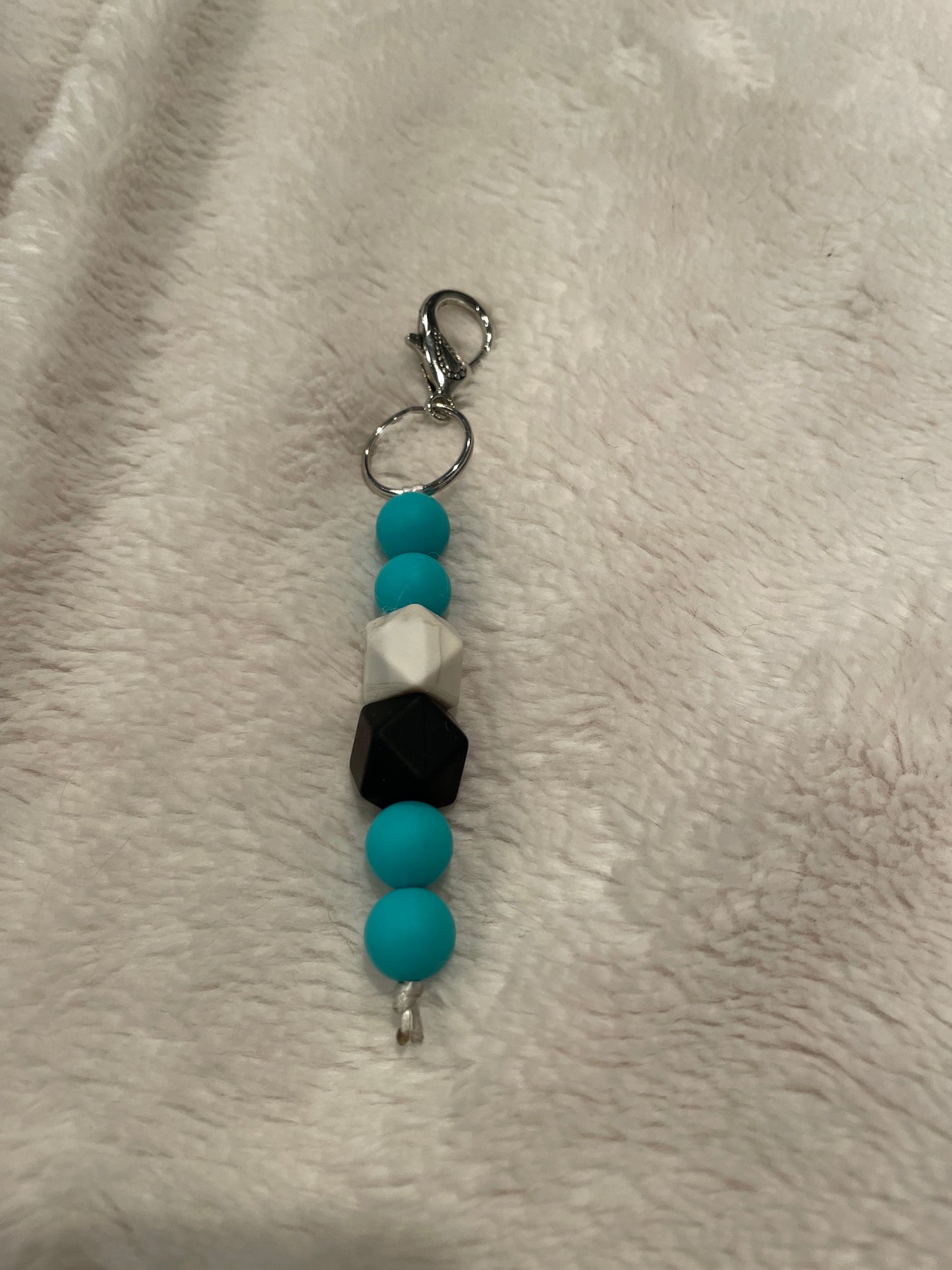 teal and black keychain