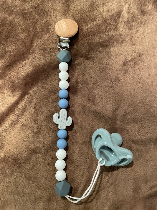 blue and gray paci clip