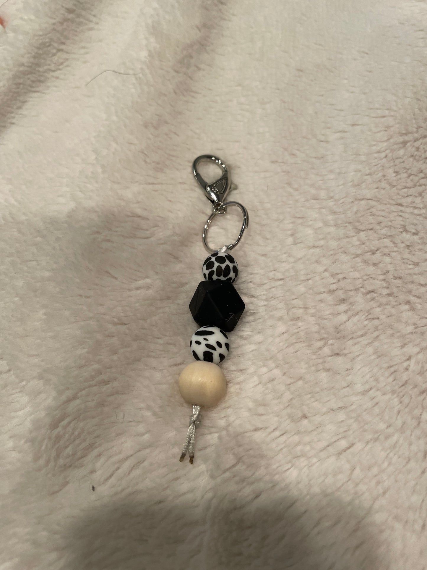 black and cowprint keychain