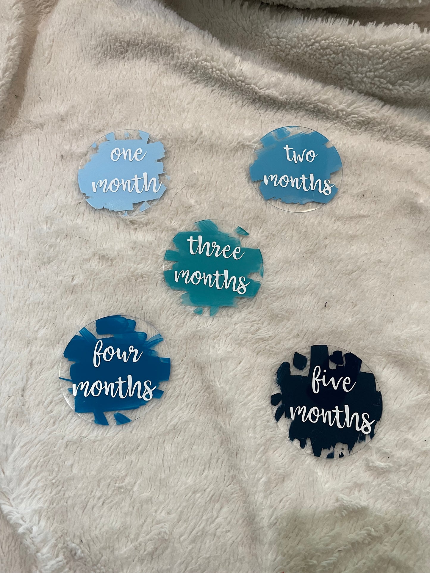 one through twelve month milestone signs